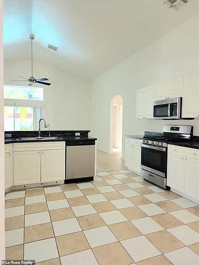 Kitchen: The kitchen has a vintage feel due to the checkerboard tiled floor.