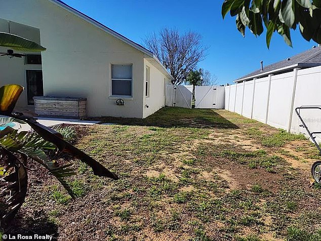 Privacy - Backyard is lined with white privacy fencing