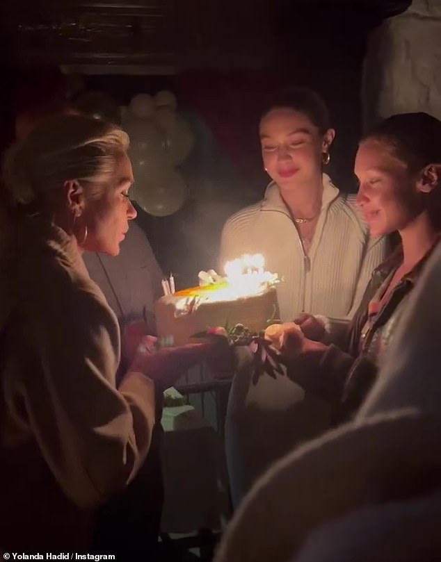 Birthday Wish: After closing her eyes to make a quick wish, Yolanda blows out a portion of the candles on the cake before trying again to successfully blow out the rest.