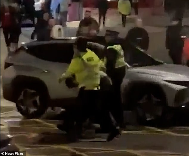 Another fan was dragged through the Old Trafford car park, where Charlton fans boarded buses for their way home.