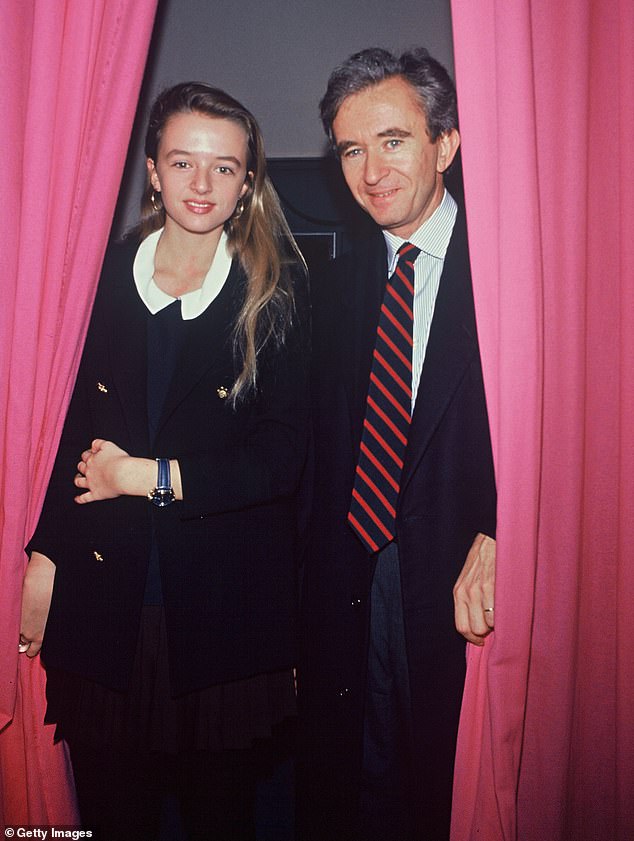 Ms Arnault (pictured with her father in 1992) was credited with keeping the brand afloat in 2011 following widely publicized revelations of an anti-Semitic outburst in Paris by its British creative director John Galliano that led to upon his dismissal.