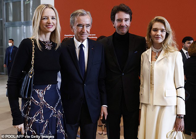 Ms. Arnault is also a member of LVMH's board of directors and its executive committee.  In the 2021 photo, from left to right: Delphine Arnault, Bernard Arnault, Antoine Arnault and his wife, Russian model Natalia Vodianova