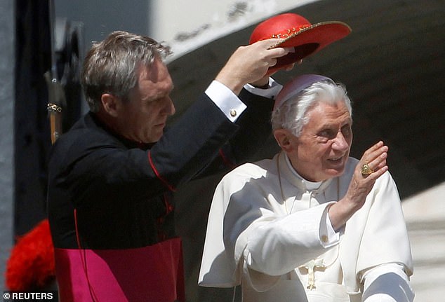 Gaenswein was a constant presence at Benedict's side, and during his final years living in a monastery in the Vatican grounds, his gatekeeper (pictured together in 2011)