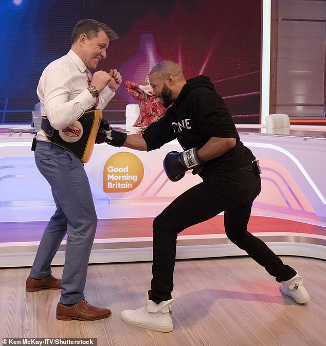 Dealing with the punches: Good Morning Britain presenter Ben, 48, bravely took up the challenge on Thursday morning as his co-presenters Kate Garraway and Ranveer Singh looked on