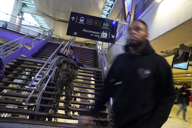 A soldier patrols at the Gare du Nord train station, Wednesday, January 11, 2023, in Paris.