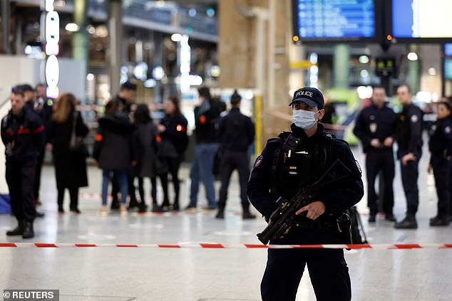 French police secure the area after a man stabbed several people at the Gare du Nord train station in Paris.