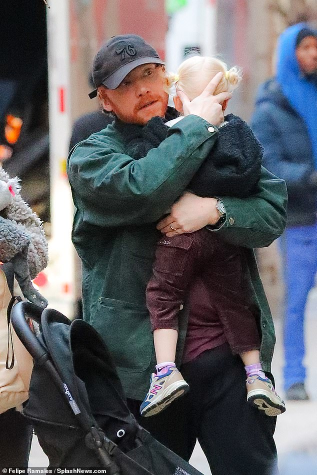 Out and about: The Harry Potter star, who has been in the midst of promotional duties for his AppleTV+ series Servant, was seen holding the two-year-old