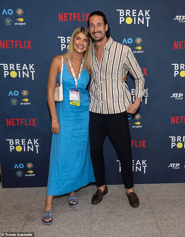 Love Island star Anna McEvoy looked glam in a blue maxi dress paired with a white bag and sandals.  Pictured here with her boyfriend Michael Staples