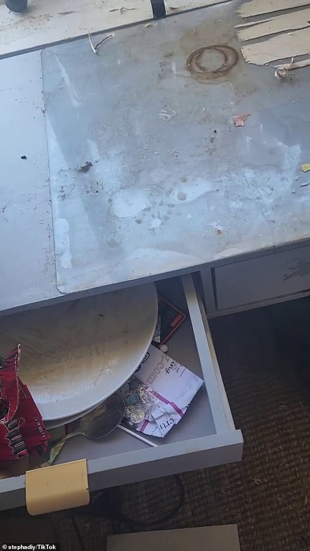 The drawers contained dirty plates and silverware with food all over it.