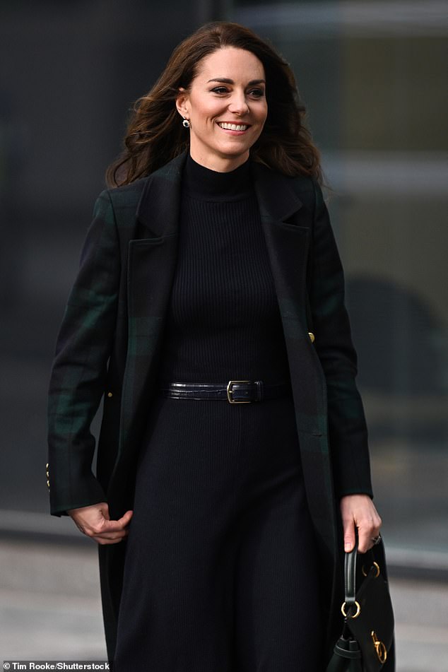 Kate looked as elegant as ever, her trench coat open to reveal her navy blue dress underneath.