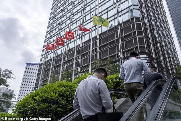 Layoffs began in Asia, including at Goldman Sachs, its Hong Kong branch (above).