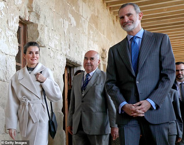 The King of Spain smiles during the tour, which marks the couple's first joint outing since their uncle's death