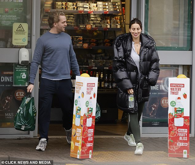 Getting along: The couple was having a good laugh while dating