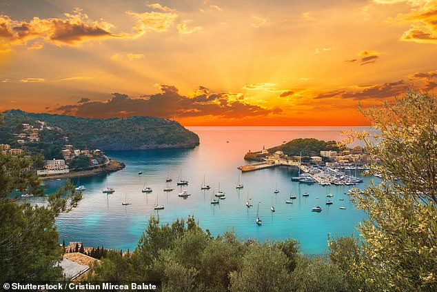 View of the famous Soller Port Marina and Dockland illuminated by sunset light in Palma de Majorca in Spain