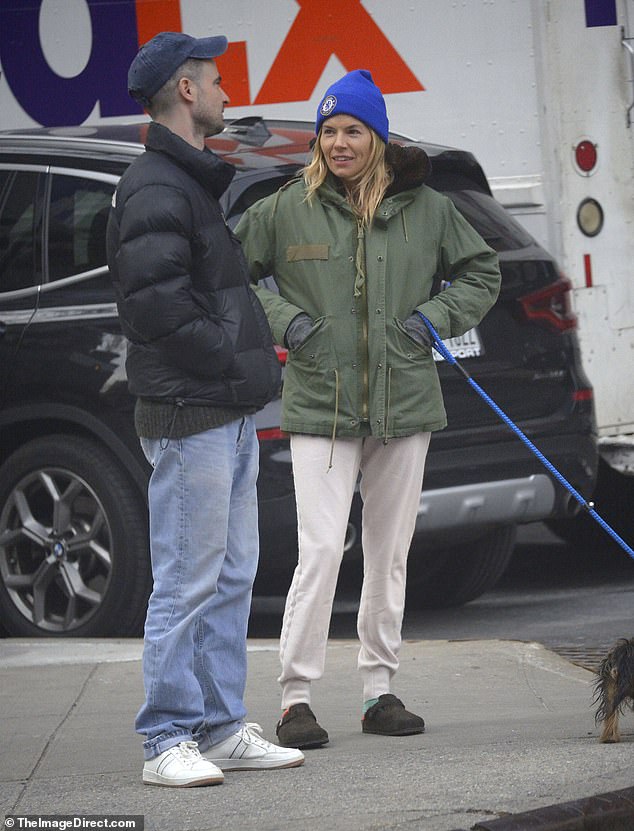 Fun: Sienna, 41, and actor Tom, 37, who share a daughter, Marlowe, 10, looked in high spirits as they caught up during a dog walk in the Big Apple