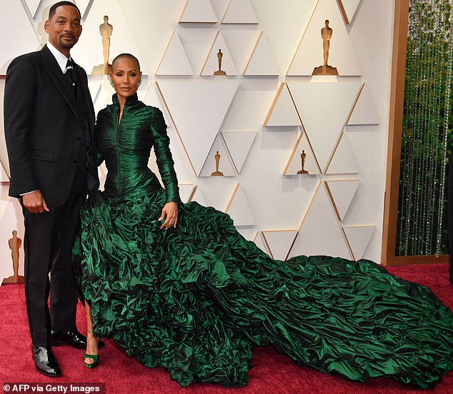 As seen on the red carpet: Will was initially seen laughing at the joke, but Jada rolled her eyes and he stormed onto the stage to slap Chris across the face.