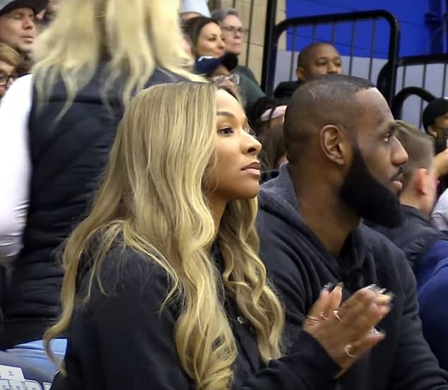 James and his wife Savannah sat courtside to cheer on their oldest son at the game.