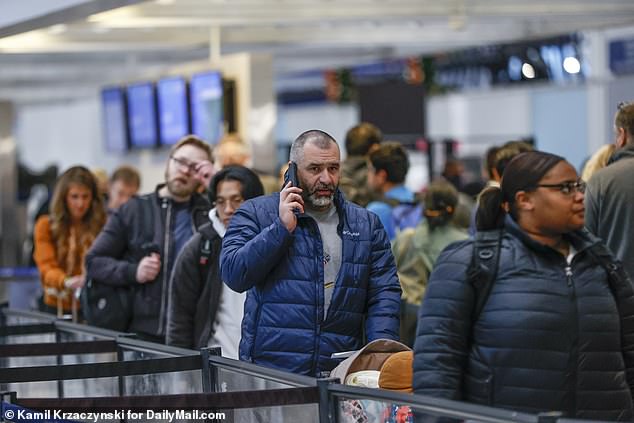 Passengers at Chicago's O'Hare airport Wednesday after a 