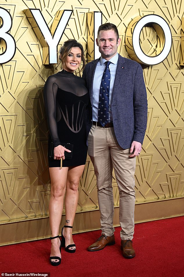 Couple: Kym was joined at the premiere by her husband Scott Ratcliff, who looked dapper in a gray blazer and tan pants that he teamed with a light blue shirt