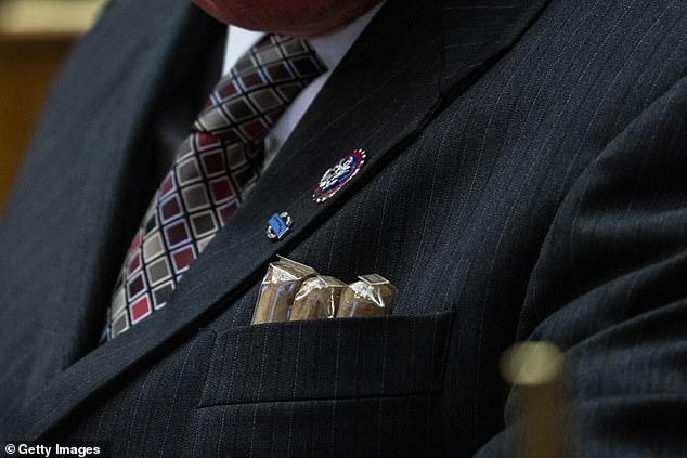 Cigars protrude from the suit jacket pocket of Rep. Troy Nehls (R-TX)