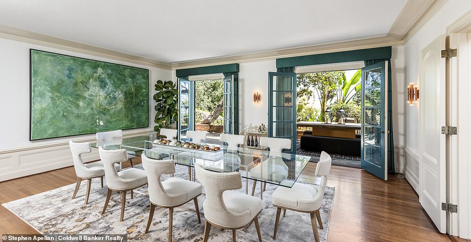 The large formal rooms and outdoor living room are ideal for large groups and family gatherings, with relaxed interior-exterior architecture that makes the most of California's sunny weather (pictured: a dining room)