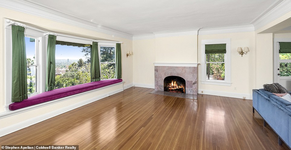 One of the large rooms had hardwood floors, views of the city, and a fireplace.