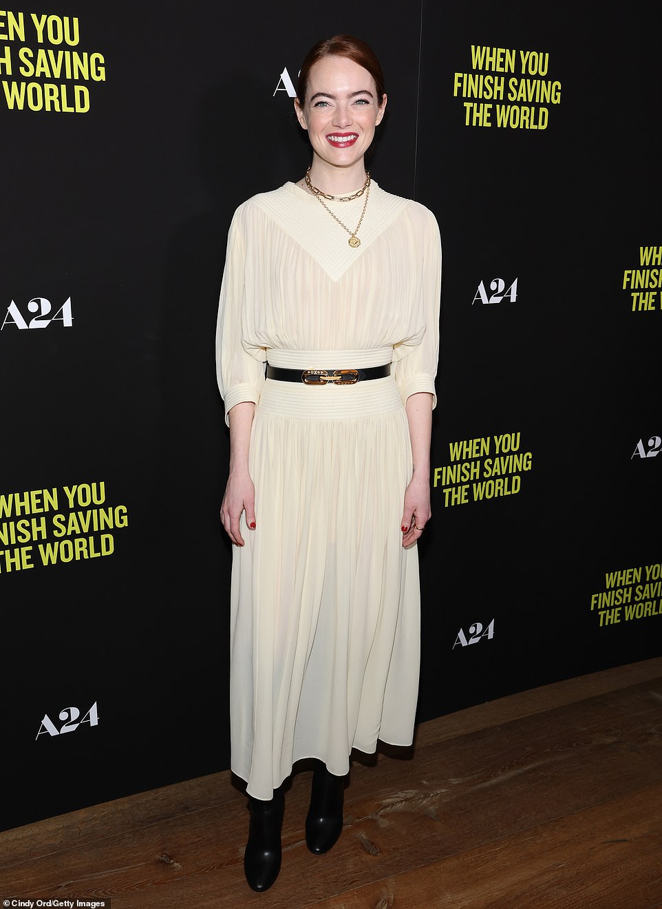 Sophisticated: And while McCary skipped the red carpet, Stone happily posed in a cream midi-sleeved dress and black boots curated by her stylist Petra Flannery