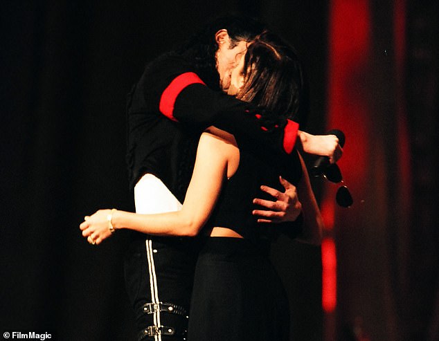 Lisa Marie Presley and Michael Jackson kiss onstage at the 1994 MTV Video Music Awards