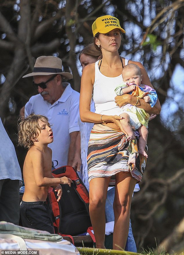 Rocket and Mars continued to run around in their bathing suits, trying to corner their mother into playing while they enjoyed their time outdoors.