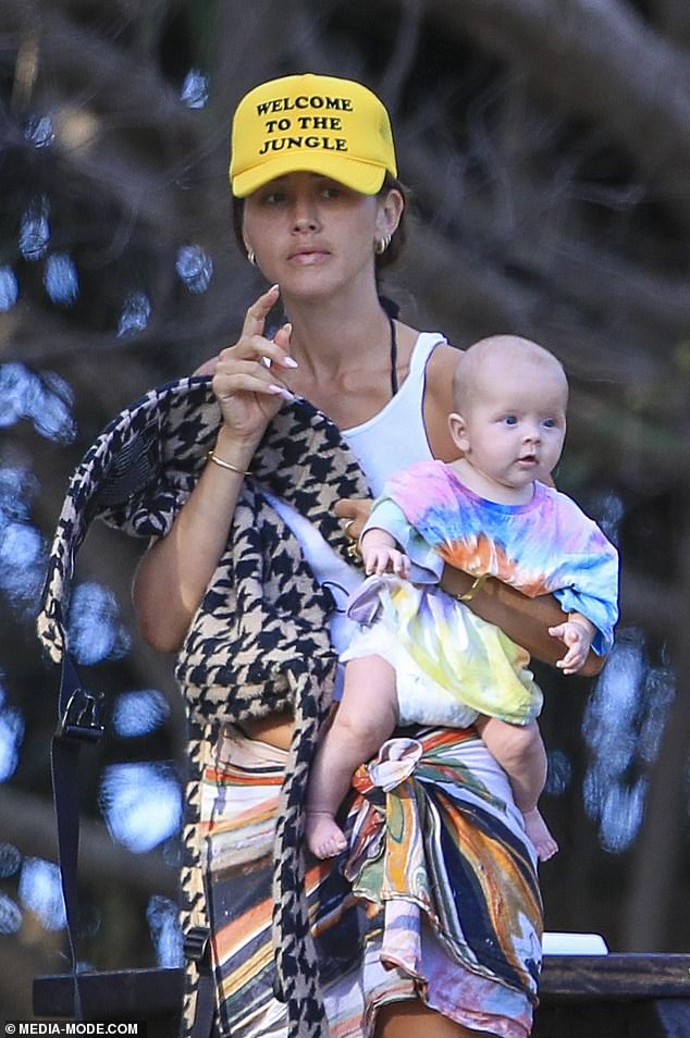 Without makeup, she accessorized her look with a fresh set of white nails.