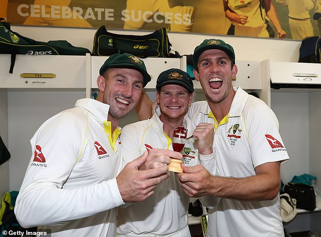 Australia's Shaun Marsh, Steve Smith and Mitch Marsh celebrate in the dressing room after Australia regained the Ashes in England