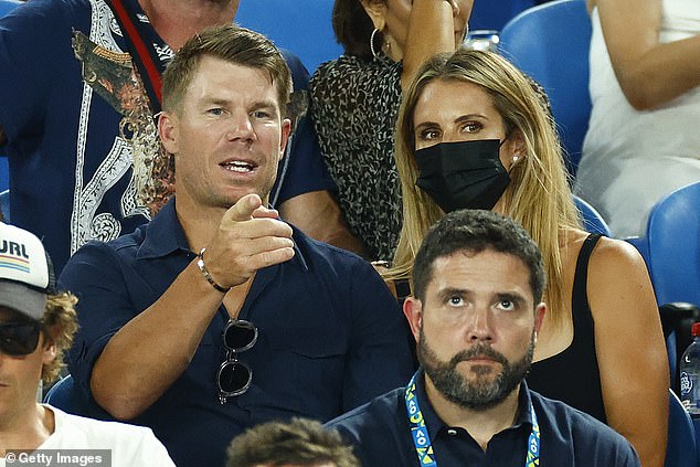 David Warner and his wife Candice watch the men's singles final match between Rafael Nadal of Spain and Daniil Medvedev of Russia at Rod Laver Arena at the Australian Open 2022