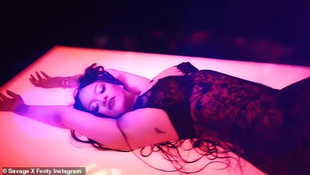 Sexy: She was lying on the glowing platform with her arms above her head.