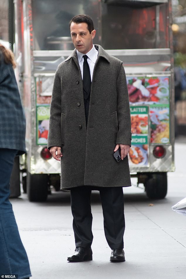 Jeremy's look: Strong was seen wearing a smart suit with a brown wool coat in the scene, where his character Kendall Roy was fighting with his ex-wife Rava Roy.