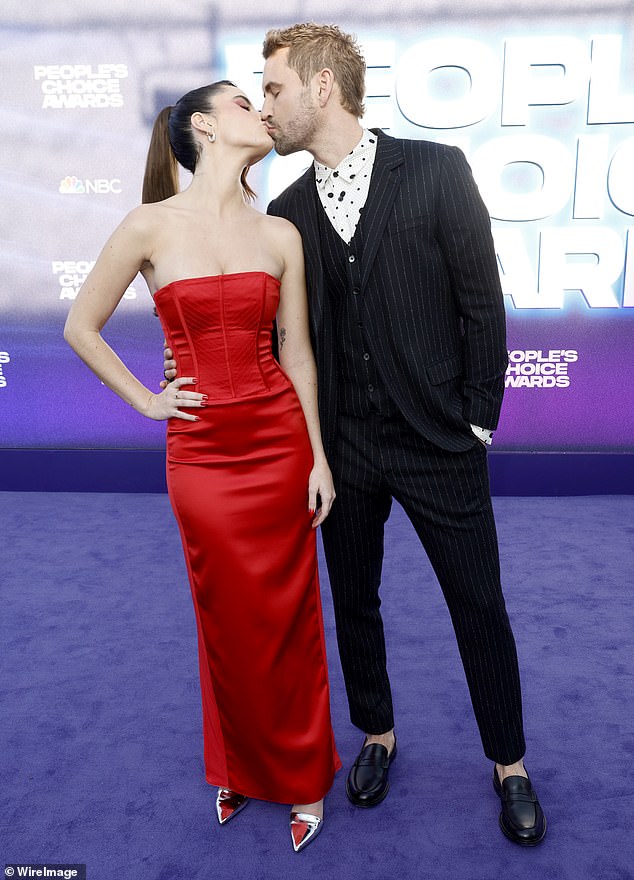 Not single anymore: The reality star, who had a romantic moment with Joy at the People's Choice Awards last month (pictured), posted a collection of engagement photos to his Instagram on Thursday  