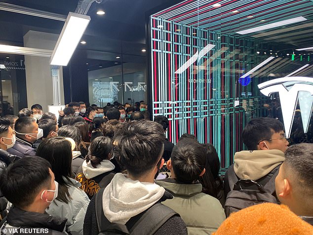 Protesters gather at a Tesla showroom in Chengdu, Sichuan, China, on January 6, after the brand announced huge price cuts on its new cars