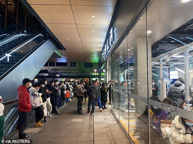 Demonstrators outside a Tesla showroom in Chengdu, Sichuan, China, on January 6, 2023