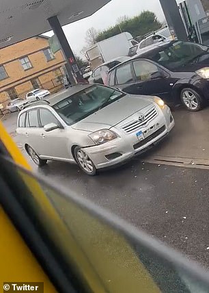 Footage shows the woman reversing her Toyota, with its number plate now hanging precariously off the damaged bumper, backwards again before driving forwards and parking next to the victim's car.