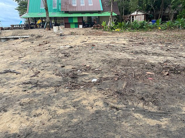 Pictured: The supposed luxury beach the couple had been promised is seen covered in trash