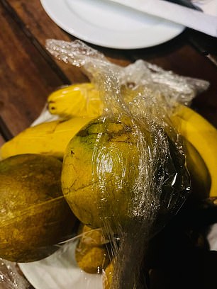 The couple claims the representative only arrived the day before they were due to leave Thailand, with a bowl of rotting fruit (right) and an offer of a free massage