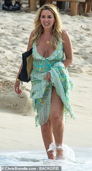 Beach babe: The actress, 51, looked gorgeous in a chic green dress