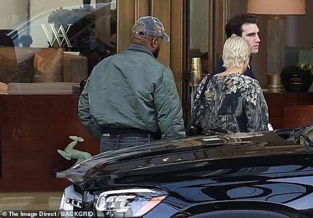 Ye was seen wearing black jeans, lace-up boots, a bomber jacket, and a camouflage cap.