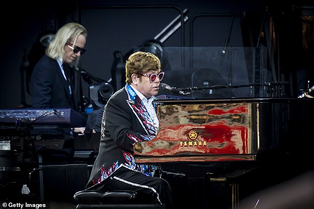 Elton, playing his final shows in Australia, wore a black tuxedo with a train for the first of his two shows in Melbourne on Friday.