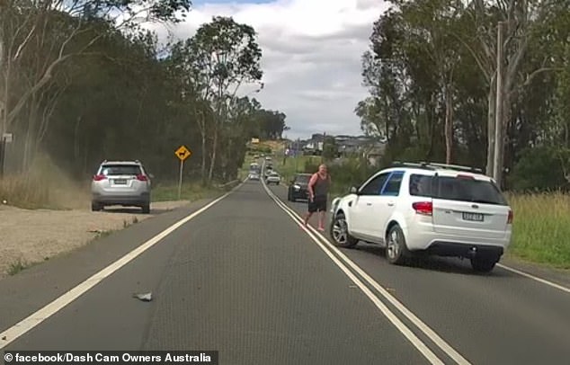 The driver of the RAV4 is seen angrily confronting the other motorist, despite many accusing him of being in the wrong.