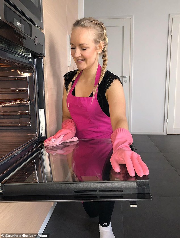 Auri Kananen, 28, from Tampere, Finland, (pictured) has amassed more than 8 million followers on TikTok for sharing videos of her cleaning people's houses.