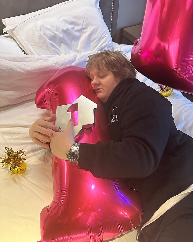 Happy!  The Scottish singer took to Instagram to mark the achievement, sharing photos of himself licking and hugging number one balloons.