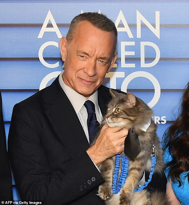 US actor Tom Hanks and the cat Smeagol arrive at a special screening of Columbia Pictures' A Man Called Otto.