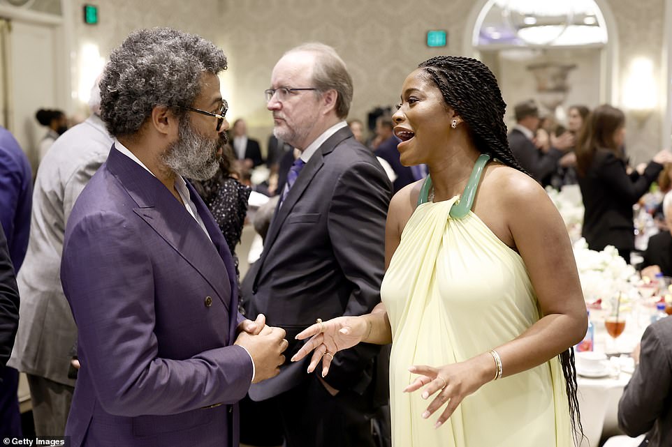 Reaching!  Jordan Peele and Keke Palmer spotted chatting together