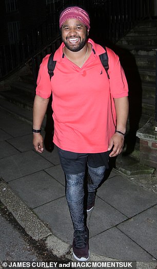 Radiant: Winner Hamza Yassin wore a bright pink T-shirt and black shorts as he left the studios