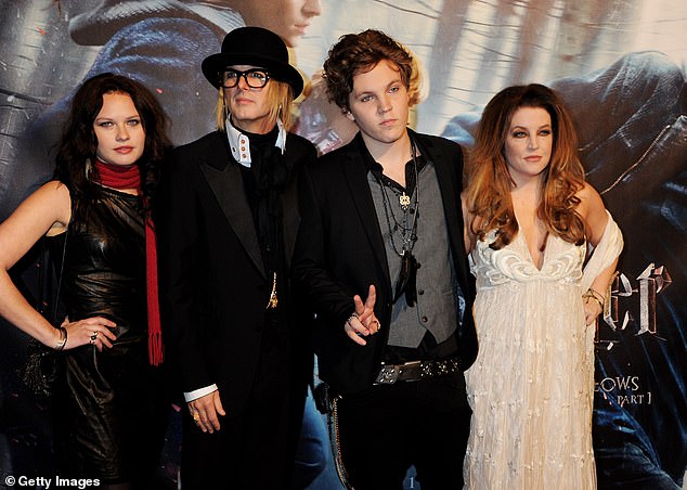 Lisa Marie tried to keep most of her battles private, but after marrying musician Michael Lockwood and having twins Finley and Harper Vivienne together, the couple went through a bitter divorce.  Above, Lisa Marie, right, and Michael Lockwood, second from left, with Lisa Marie's children Riley and Benjamin Keough.